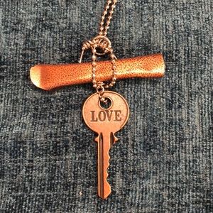 Vintage look, long chain necklace with a LOVE key.